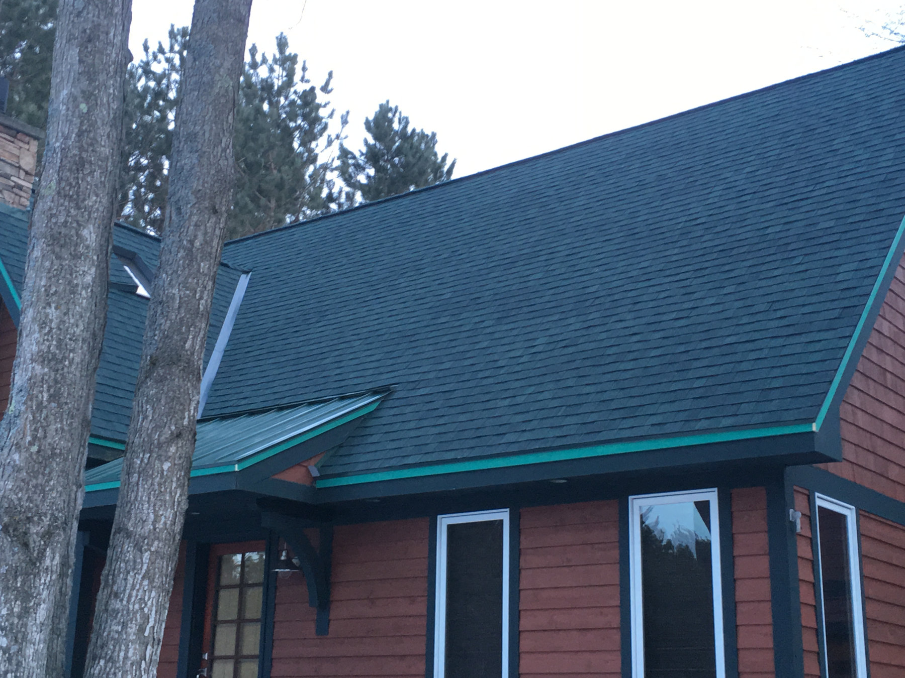 Shingle with standing seam accent